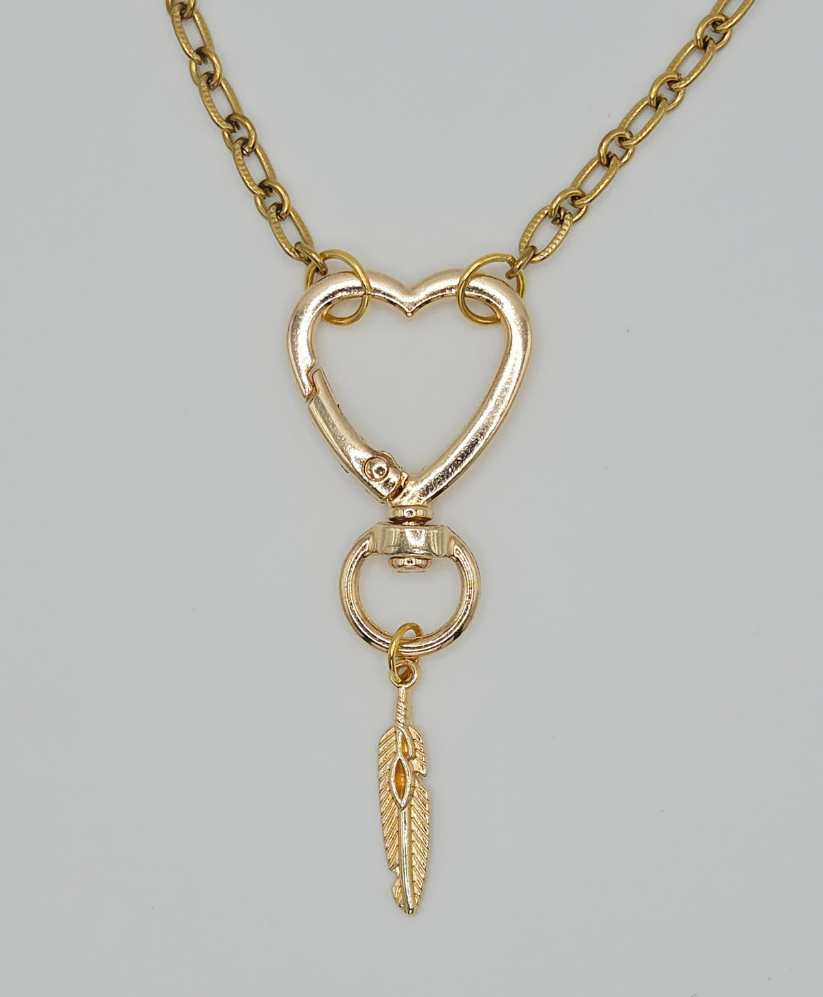 One-of-a-Kind Gold Tone Heart Clasp & Feather Charm Pendant Necklace (18") – Olivia Sparkles Fall 2026 Collection